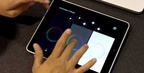 A person drawing on the ipad screen.
