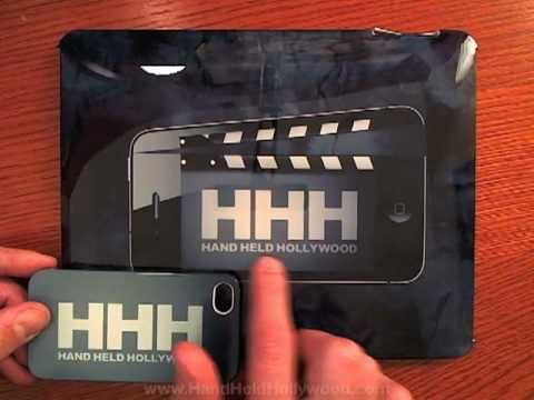 A person is holding an iPhone with a custom case featuring a hh logo.