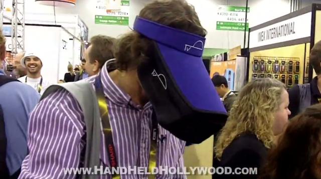 A man wearing a blue hat at a CES convention.