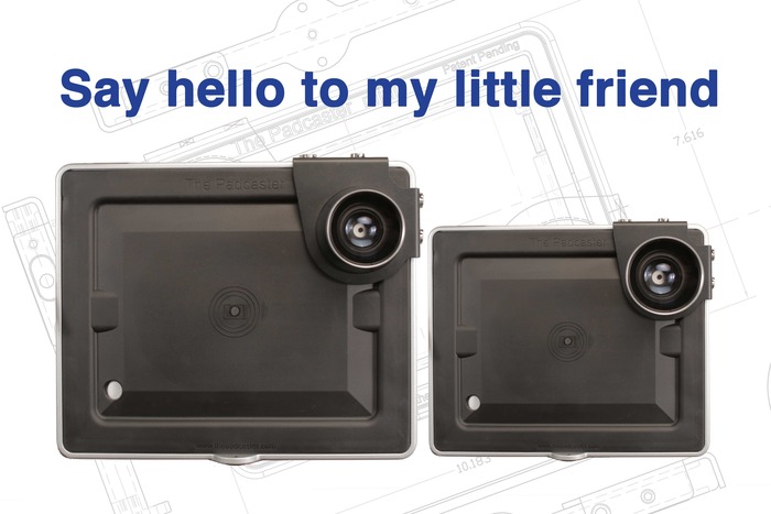 Compact camera module on a technical blueprint background with the phrase "say hello to my little friend" displayed on an iPad Mini.