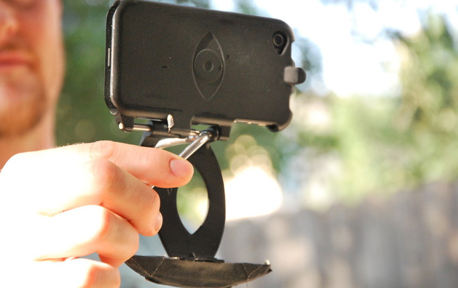 A man holding up a cell phone, improved with the Stabil-i iPhone Stabilizer.