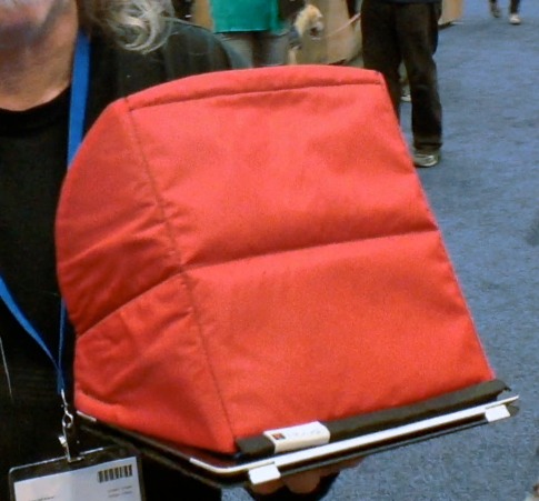 A man holding a red bag at iWorld.