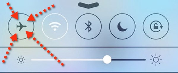 Airplane mode activated on a smartphone's Control Center with brightness adjustment below in iOS7.