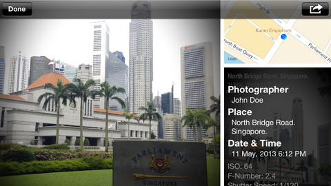 A screenshot of a photo information screen from Map Camera showing a cityscape with skyscrapers and a sign that reads "parliament" in the foreground, indicating the image was taken at North Bridge Road