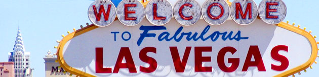 Iconic "welcome to fabulous Vegas" sign under a clear HHH sky.